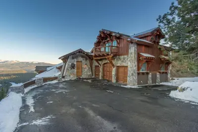 a house on top of a hill with snow at Skislope-Tahoe Villa in Truckee