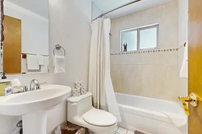 a bathroom with a sink and a toilet and a tub at Relaxed and Comfortable Family Gathering Home in Truckee