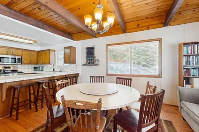 a kitchen and dining room with a table and chairs at Relaxed and Comfortable Family Gathering Home in Truckee