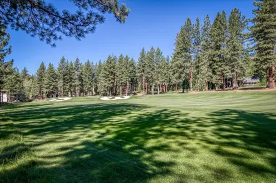 a view of a golf course with trees at Fairway Park Cabin in Incline Village