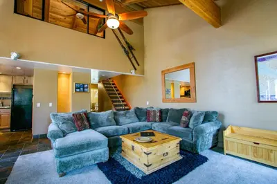 a living room with a couch and a table at Val D'Isere #1 Condo in Mammoth Lakes