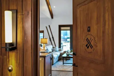 a room with a door with a living room at Luxury Two Bedroom Residence Steps From Heavenly Village Condo in South Lake Tahoe