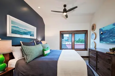 a bedroom with a bed and a ceiling fan at Luxury Two Bedroom Residence Steps From Heavenly Village Condo in South Lake Tahoe