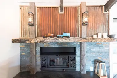 a fireplace with a toy train on top of it at Moon Ranch - a gateway to Yosemite in Mariposa