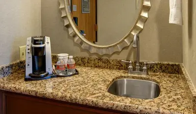 a bathroom counter with a sink and a mirror at Nugget Casino Resort in Reno