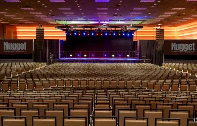 an empty auditorium with a stage and chairs at Nugget Casino Resort in Reno
