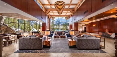 a lobby of a resort with couches and tables at Everline Resort and Spa, Lake Tahoe in Olympic Valley