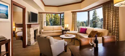 a living room with a couch and a table at Everline Resort and Spa, Lake Tahoe in Olympic Valley