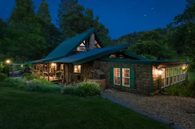 a house with a green roof at night at The Davies Family Inn in Placerville