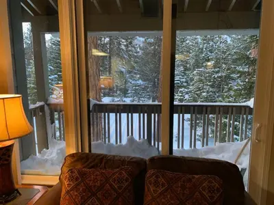 a room with a couch in front of a window at Mammoth Lakes Crestview Condo #50 in Mammoth Lakes