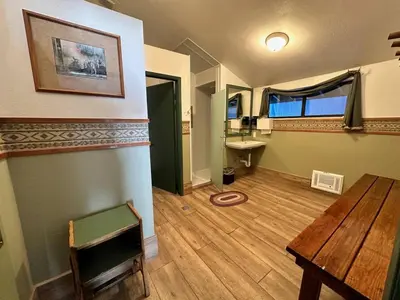 a room with a table and a sink and a desk at Mammoth Lakes Crestview Condo #50 in Mammoth Lakes
