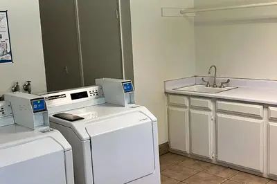 a laundry room with two washes and a sink at Sherwin Villas B13 in Mammoth Lakes