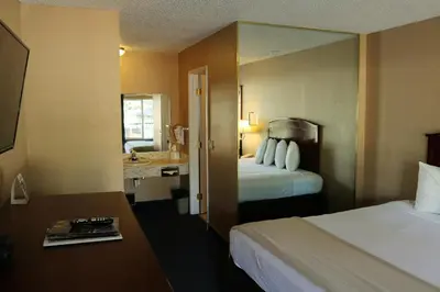 a hotel room with two beds and a sink at Bluelake Inn @ Heavenly Village in South Lake Tahoe