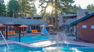 a swimming pool in the middle of a resort at 3 Peaks Resort & Beach Club in South Lake Tahoe