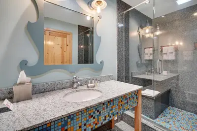a bathroom with a sink and a shower at 3 Peaks Resort & Beach Club in South Lake Tahoe