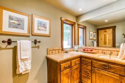 a bathroom with a sink and a counter top at Bear Meadows Lodge - Hot Tub - Tahoe Donner Home in Truckee