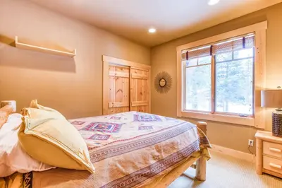 a bedroom with a bed and a window at Bear Meadows Lodge - Hot Tub - Tahoe Donner Home in Truckee