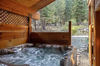 a hot tub in a cabin in the woods at Bear Meadows Lodge - Hot Tub - Tahoe Donner Home in Truckee