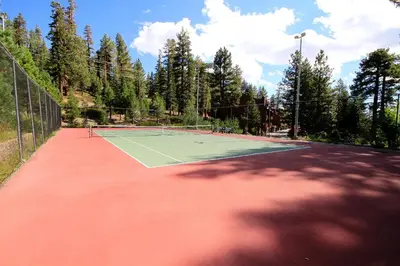 a tennis court with a tennis racket on it at Mammoth Ski Racquet Club 82 in Mammoth Lakes