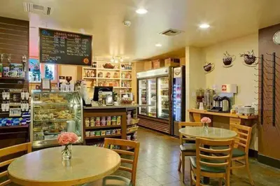 a restaurant with two tables and chairs in a store at Juniper Springs Lodge #543 in Mammoth Lakes