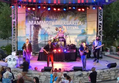 a group of people on a stage with a band at Juniper Springs Lodge #543 in Mammoth Lakes