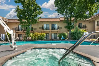 a swimming pool with a slide in a building at Best Western Plus Sonora Oaks Hotel and Conference Center in Sonora