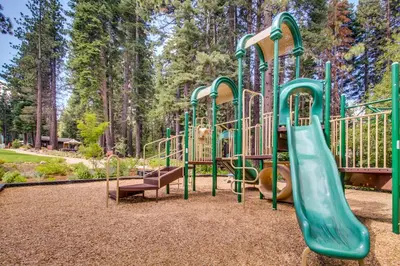 a playground with a slide in a park at Sophisticated Northstar Mountain Retreat in Truckee