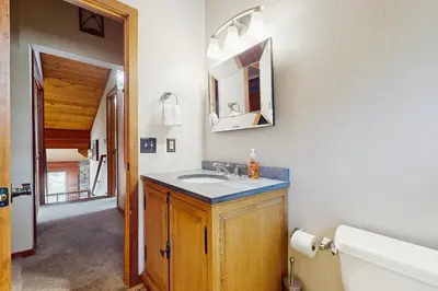a bathroom with a sink and a mirror at Sophisticated Northstar Mountain Retreat in Truckee