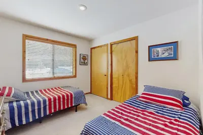 a bedroom with two beds and a window at Tuna Bush in Truckee