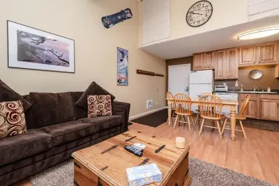 a living room with a couch and a table at Summit B- # 257 in Mammoth Lakes