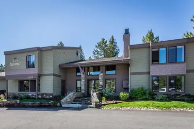 a building with an american flag in front of it at Summit B- # 257 in Mammoth Lakes
