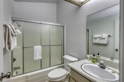 a bathroom with a toilet and a sink and a shower at The Summit 276 in Mammoth Lakes
