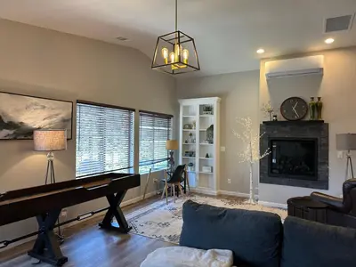 a living room with a piano and a fireplace at YoBee! Park Reservation Included! Heart of Yosemite - Homey Studios and Breakfast in Yosemite West