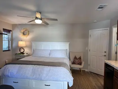 a bedroom with a bed and a ceiling fan at YoBee! Park Reservation Included! Heart of Yosemite - Homey Studios and Breakfast in Yosemite West