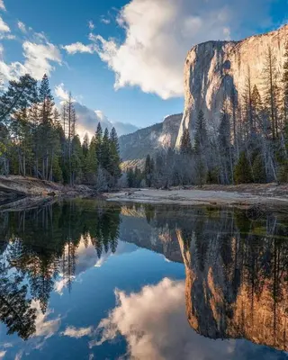 a reflection of a mountain in a lake at Oak Retreat by Yosemite National Park in Coarsegold