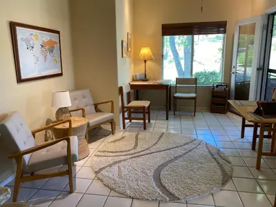 a living room with chairs and a table at Oak Retreat by Yosemite National Park in Coarsegold