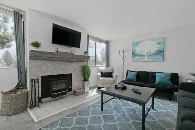 a living room with a couch and a fireplace at San Sierra 2 in Mammoth Lakes