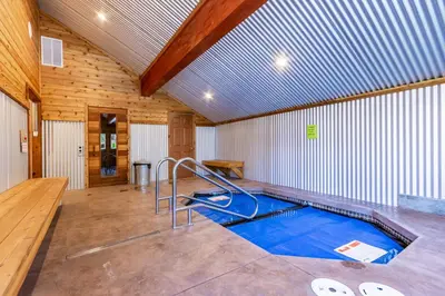 a swimming pool in a room with a wooden ceiling at San Sierra 2 in Mammoth Lakes