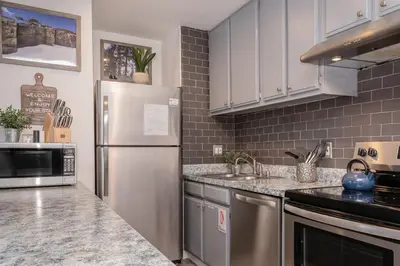 a kitchen with a stainless steel refrigerator and appliances at San Sierra 2 in Mammoth Lakes