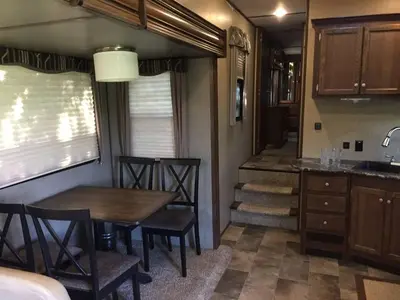 a dining room and kitchen in a tiny house at Sequoia Forest Retreat in Badger