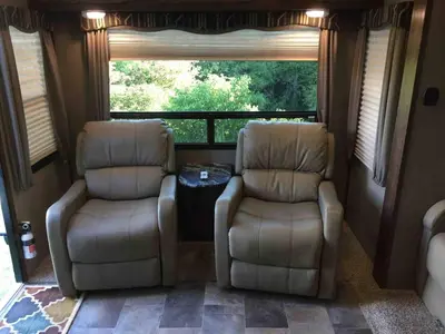 two chairs and a table in a room with a window at Sequoia Forest Retreat in Badger