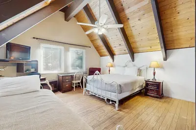 a bedroom with two beds and a ceiling fan at Tallac Views Getaway in South Lake Tahoe