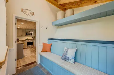 a blue bench in a room with a kitchen at Relaxation on Muletail in Carnelian Bay