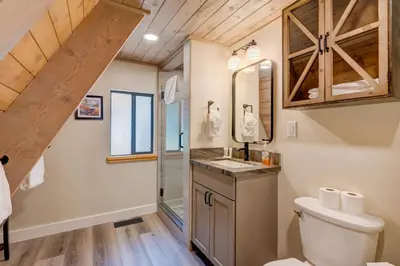 a bathroom with a toilet and a sink at Relaxation on Muletail in Carnelian Bay
