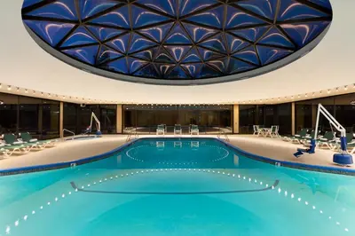 a swimming pool with a domed ceiling at Harrah's Lake Tahoe, A Caesars Destination in Stateline