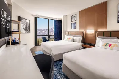 a hotel room with two beds and a window at Caesars Republic Lake Tahoe, A Caesars Destination in Stateline