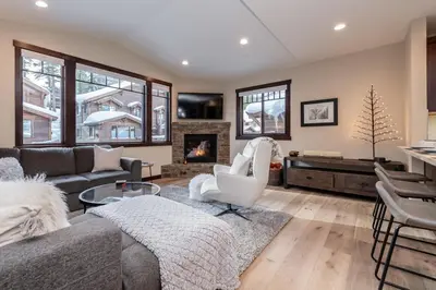 a living room with a couch and a fireplace at Mountainside 15 in Mammoth Lakes