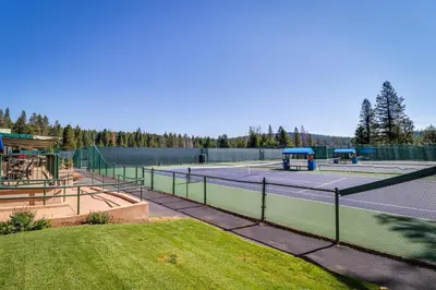 a tennis court with two tennis courts at Trout Creek Condo in Truckee