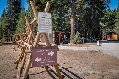 a sign in front of a park with trees at Trout Creek Condo in Truckee