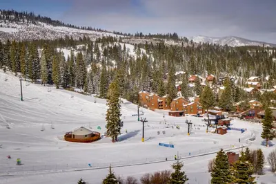 a ski resort in the snow with a lodge at Trout Creek Condo in Truckee